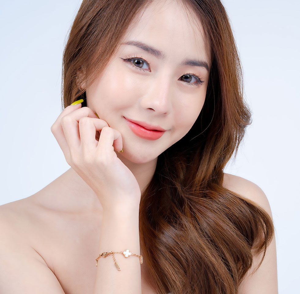 Asian woman smiling at the camera